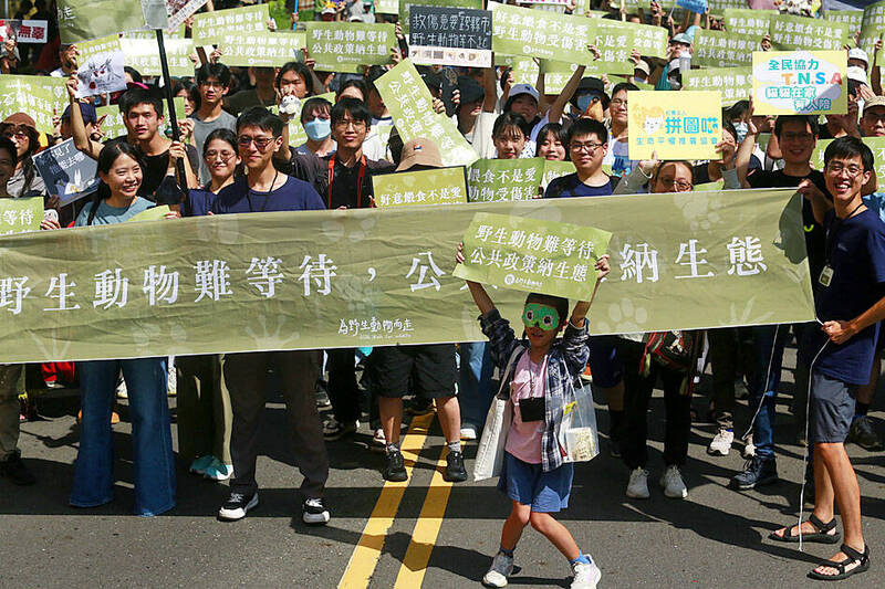 《TAIPEI TIMES》 Marchers seek to solve stray problem