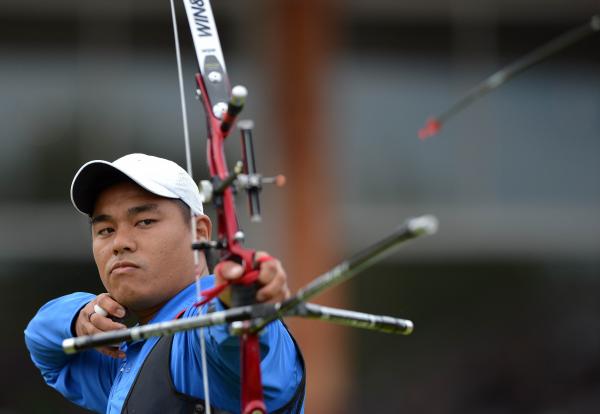 郭振維眼神殺氣十足，個人賽闖進8強。（法新社）
