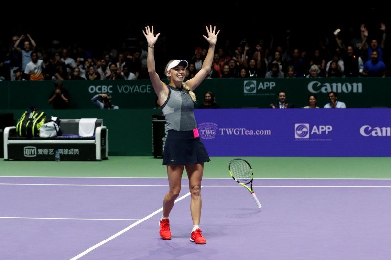 沃茲妮雅琪在WTA年終賽直落二拍落大威制霸。（路透）