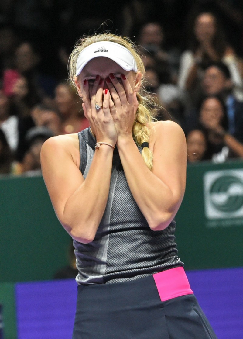 擊敗天敵大威，沃茲妮雅琪激動摀嘴。（法新社）