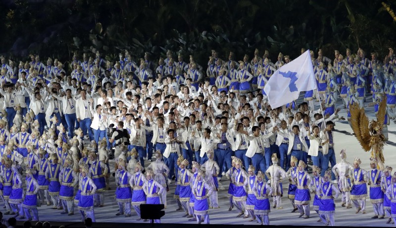 南、北韓聯隊進場。（美聯社）