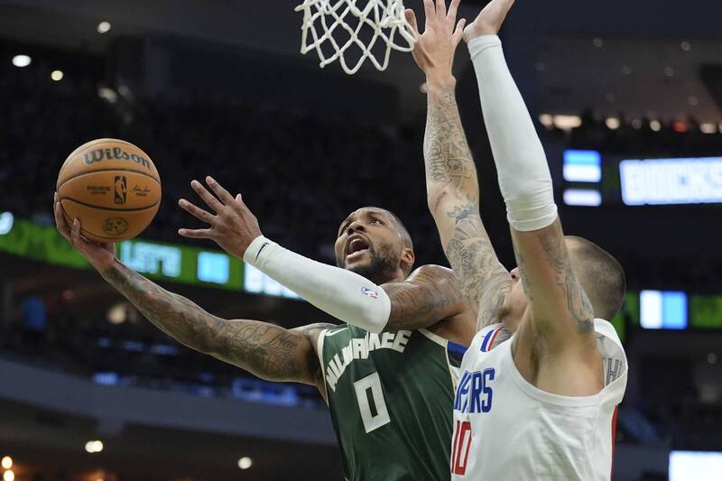 里拉德（Damian Lillard）攻下41分，公鹿末節逆轉快艇。（美聯社）