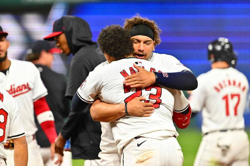 奈勒兄弟檔今天同局開轟，延長賽分別打進追平分與再見分。（法新社）