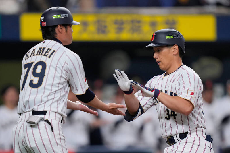 吉田正尚（右）。（美聯社）