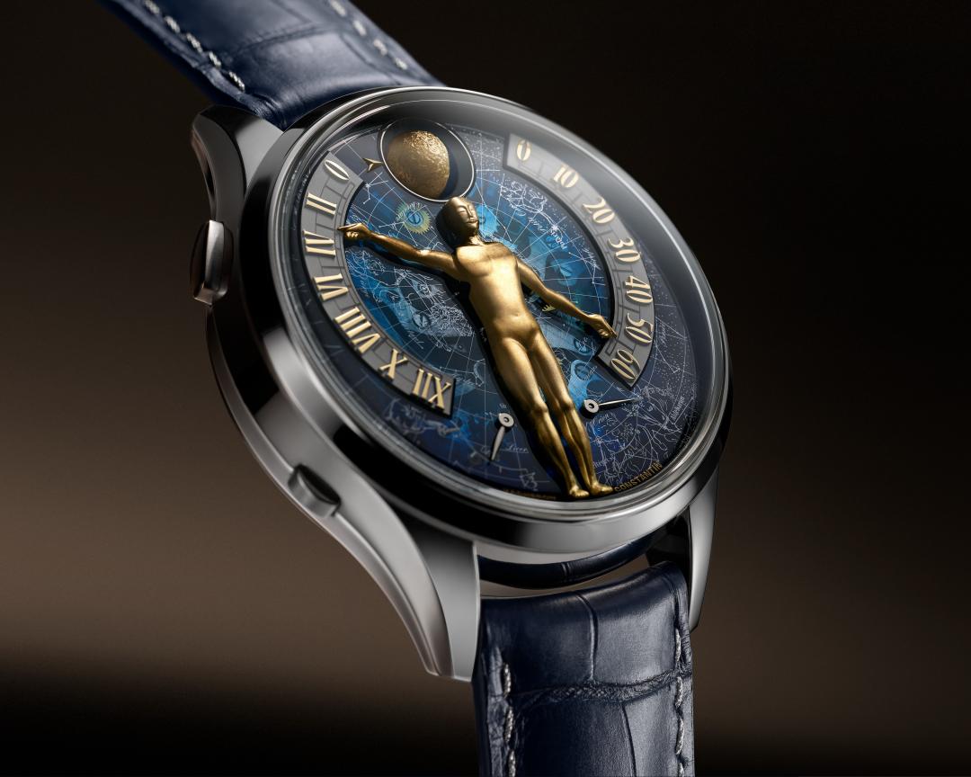 Métiers d’Art藝術大師系列 Tribute to The Quest of Time腕錶，以人偶雙手指示逆跳小時和逆跳分鐘，12點鐘位置為月相功能，下方為雙動力儲存顯示。