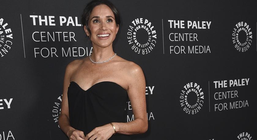 梅根積極參與各種派對活動。(美聯社)