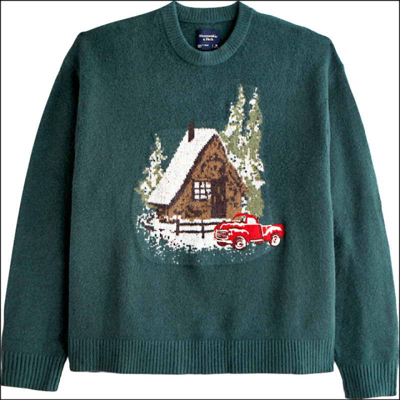 透過銀白雪景中的森林度假小屋圖騰，勾勒耶誕過節氛圍。男女共版度假小屋針織毛衣，3,690元。
