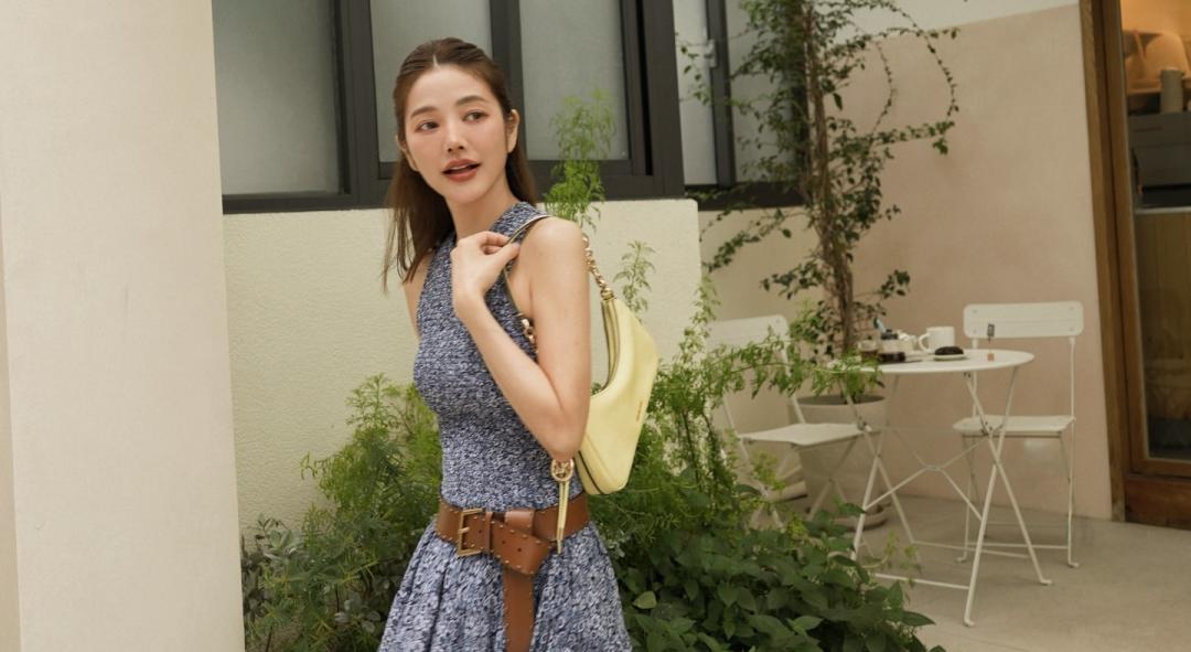 許路兒以印花前短後長洋裝，描繪春日浪漫氛圍。