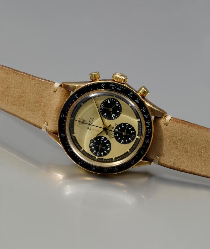 勞力士Cosmograph Daytona Ref.6264「Paul Newman Lemon」14K黃金計時腕錶，約1970年製，乳黃色面盤搭配黑色計時小盤，估價逾100萬瑞郎。（富藝斯提供）