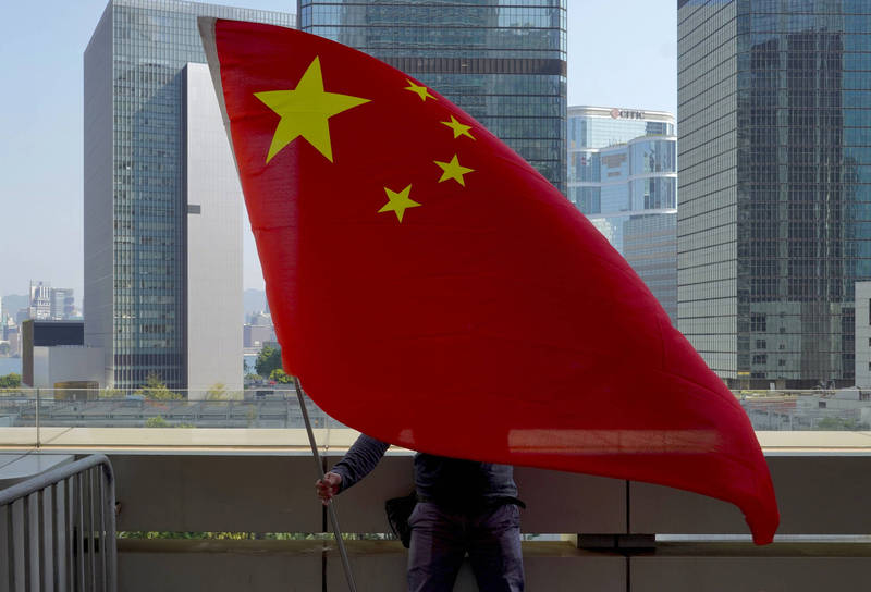 香港淪入中共專制政權轄下之後，中共統治香港的代理人正快速「戒靈」化，它所謂治港的「愛國者」，必須符合「九誡」的前提條件。（AP）